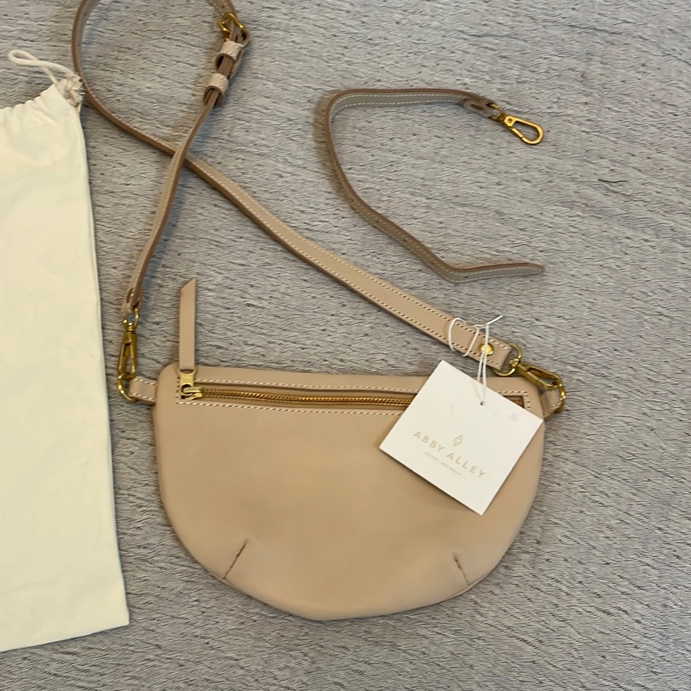 Brand new Abby Alley sling bag in Gardenia